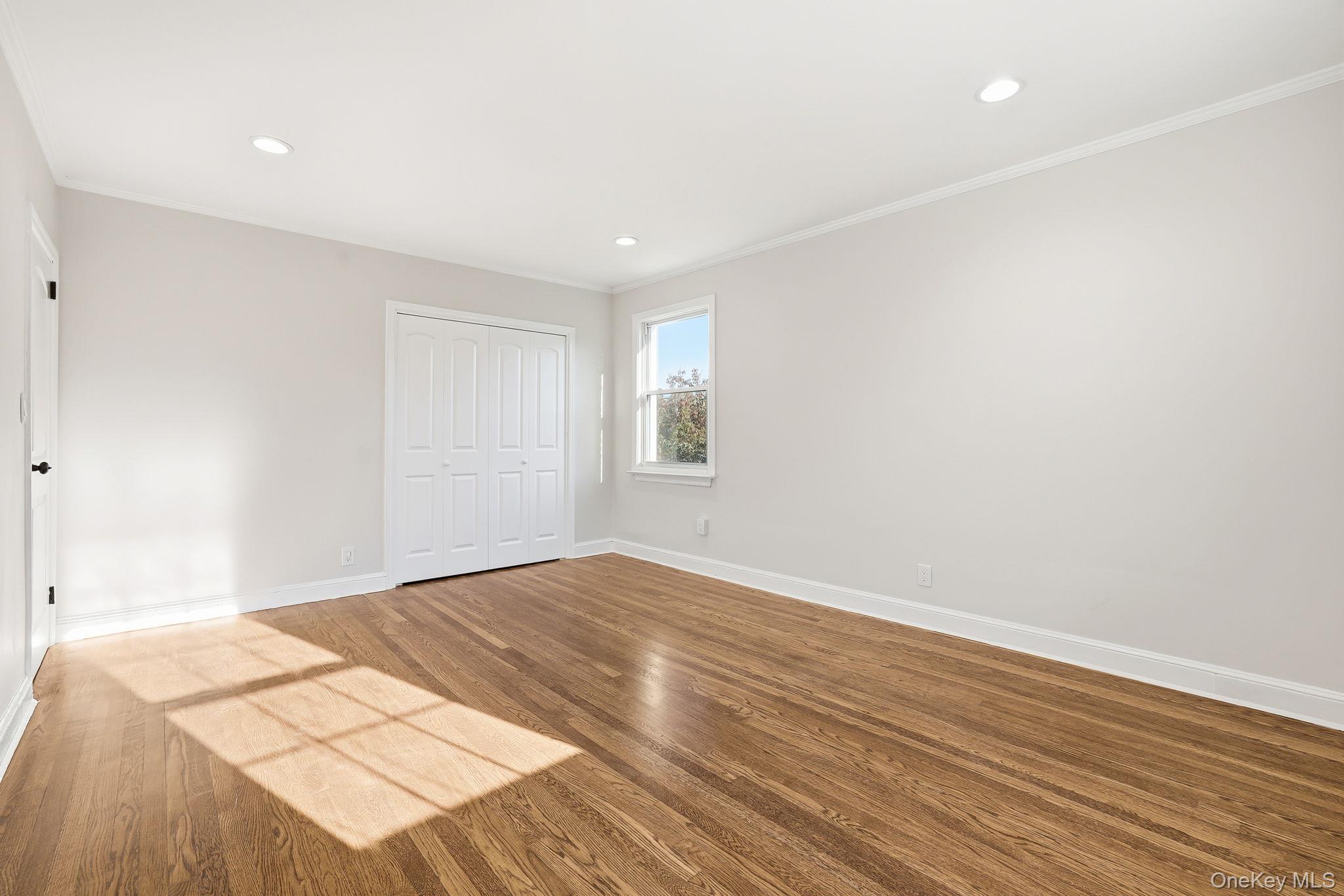 2015 Tenbroeck Avenue Bronx, NY 10461 - Photo 23 of 50 a view of an empty room with wooden floor