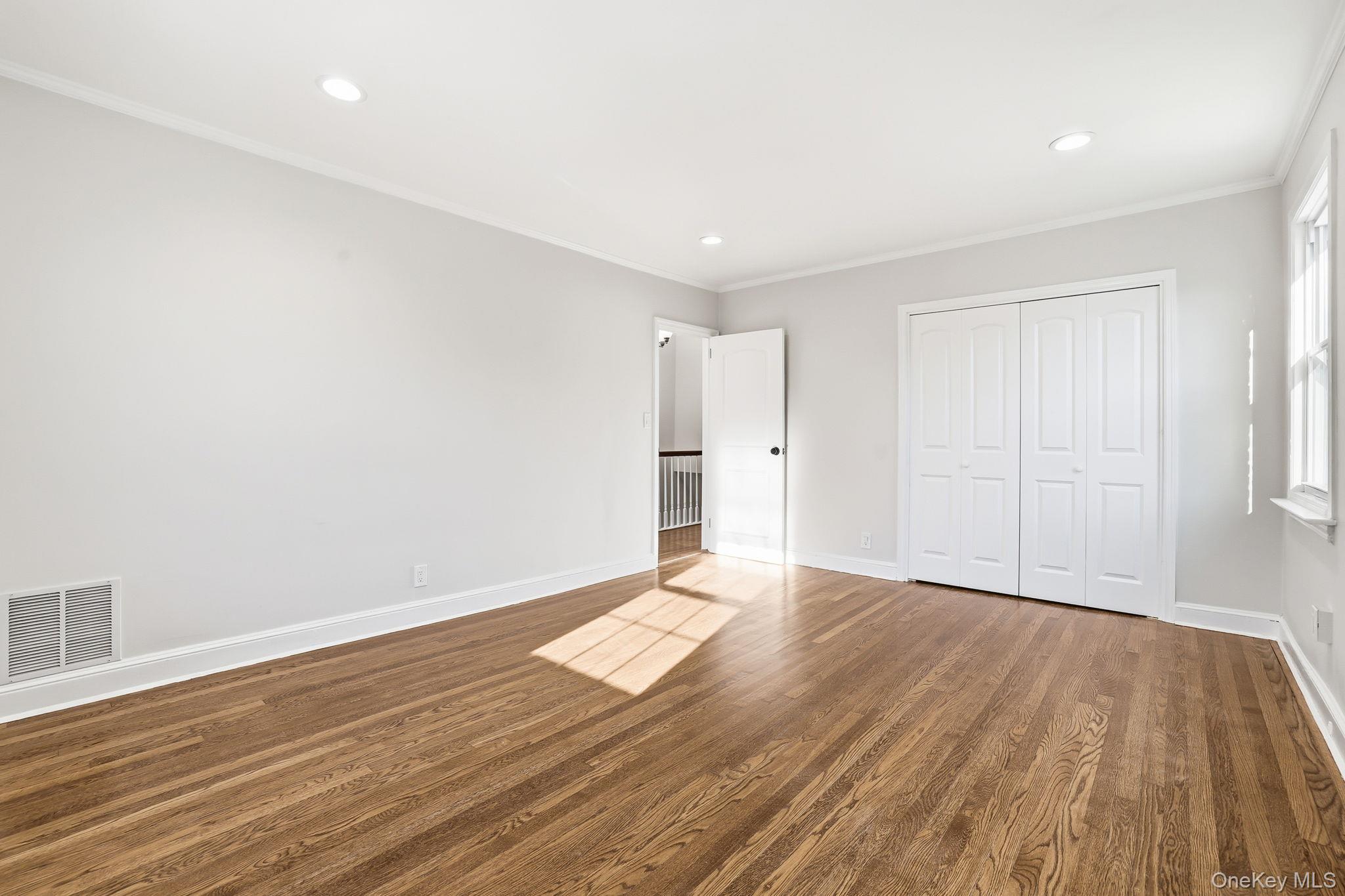 2015 Tenbroeck Avenue Bronx, NY 10461 - Photo 24 of 50 a view of an empty room with wooden floor