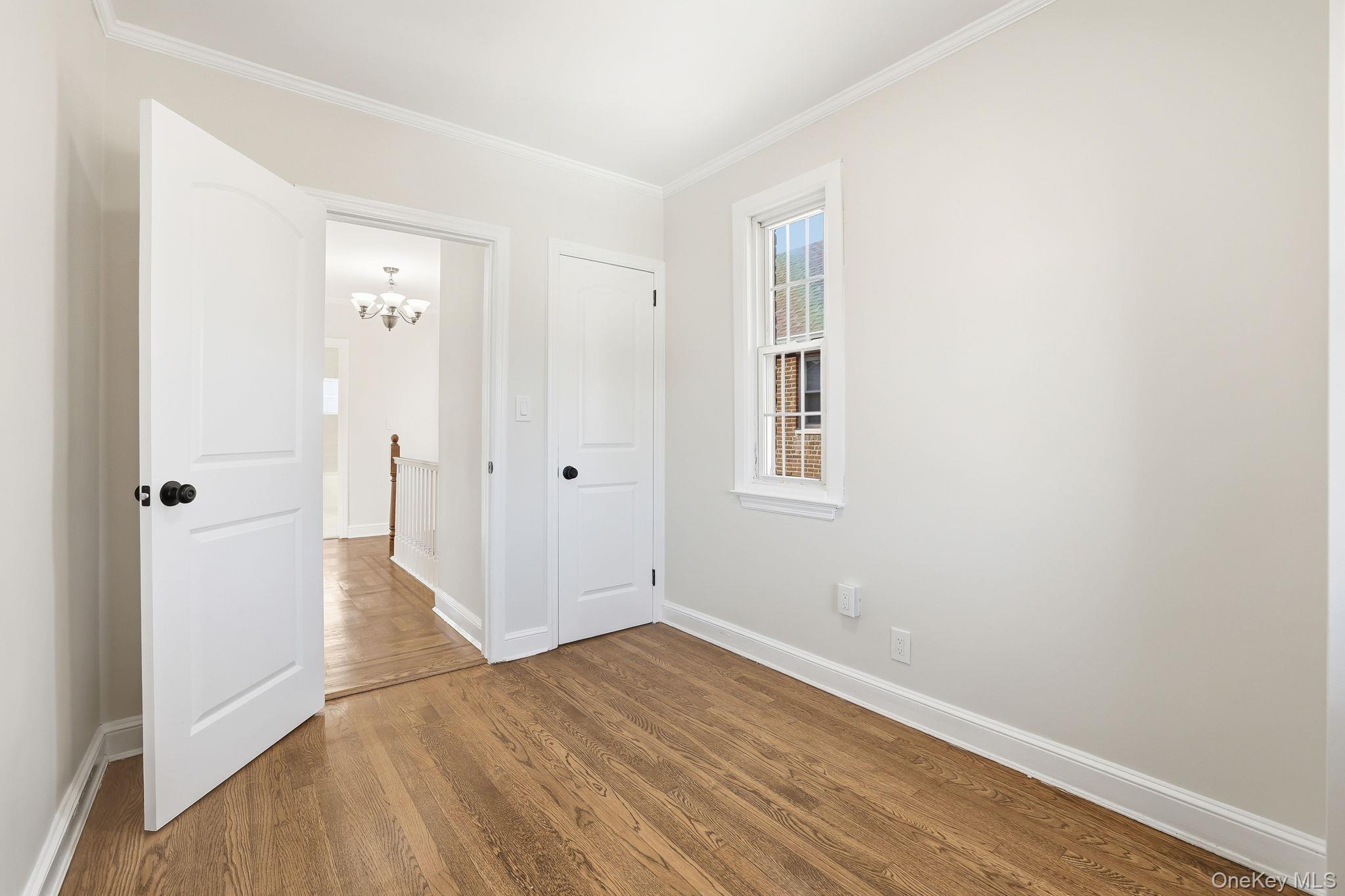 2015 Tenbroeck Avenue Bronx, NY 10461 - Photo 28 of 50 an empty room with wooden floor