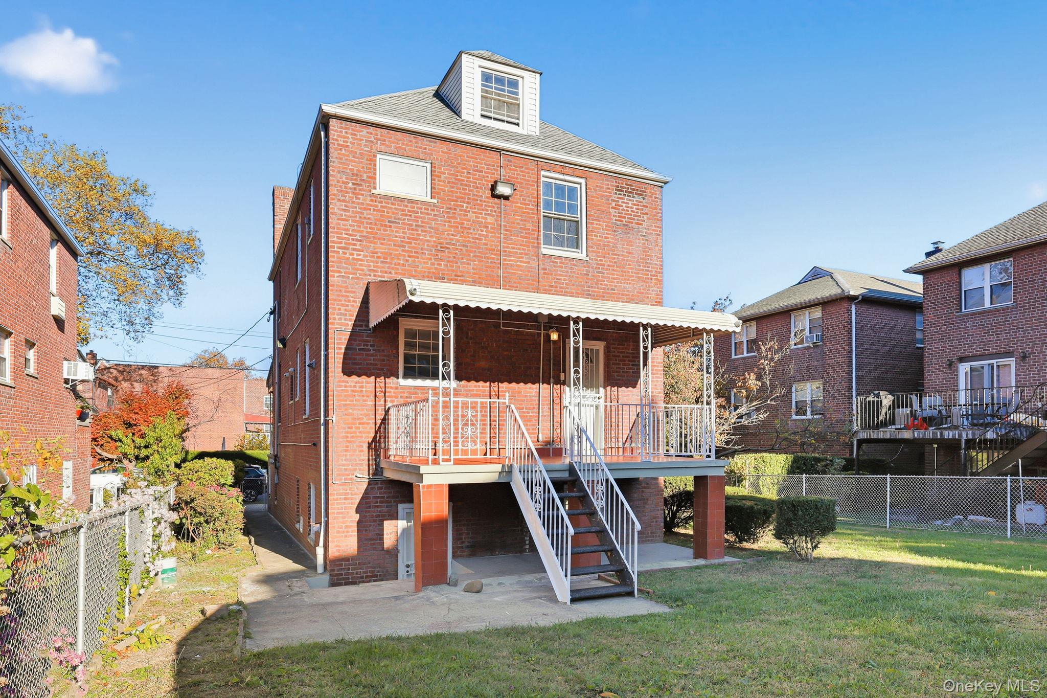 2015 Tenbroeck Avenue Bronx, NY 10461 - Photo 39 of 50 a front view of a house with a yard