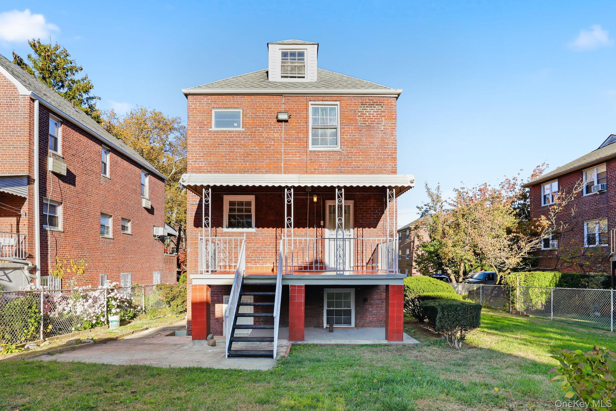 2015 Tenbroeck Avenue Bronx, NY 10461 - Photo 40 of 50 a front view of a house with garden