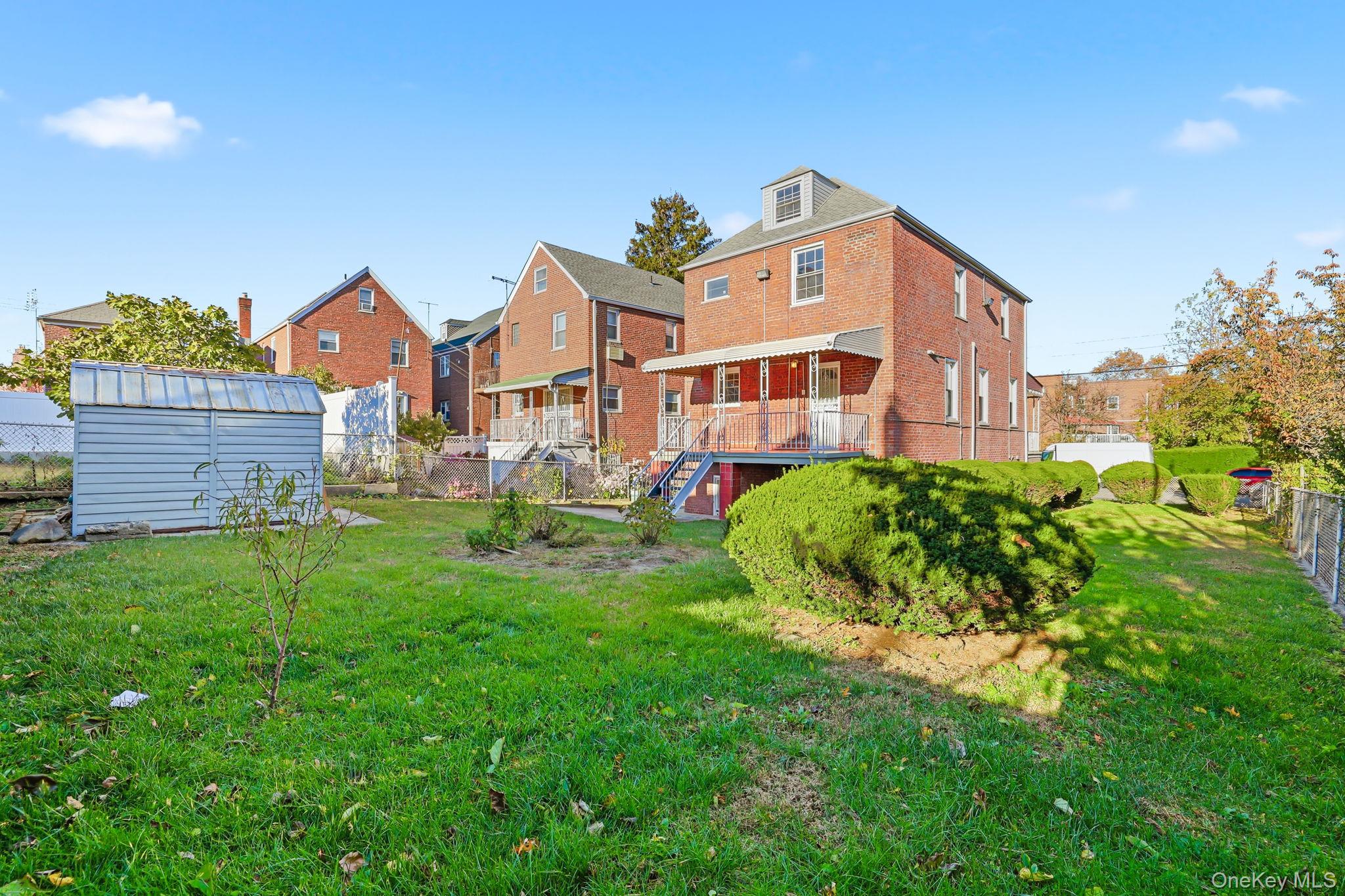 2015 Tenbroeck Avenue Bronx, NY 10461 - Photo 41 of 50 a front view of a house with a yard
