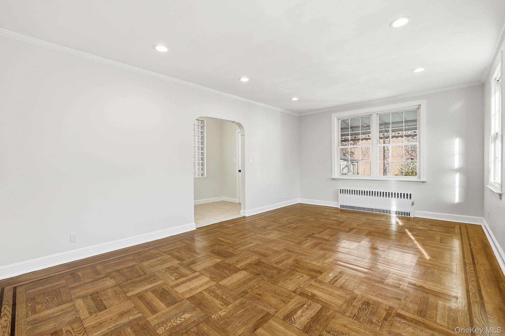 2015 Tenbroeck Avenue Bronx, NY 10461 - Photo 7 of 50 a view of empty room with wooden floor and fan