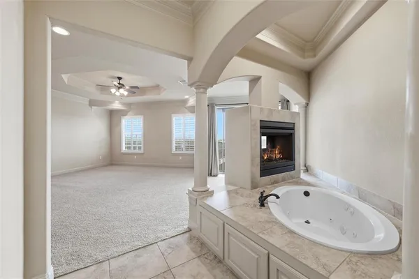 a bathroom with a granite countertop sink a large mirror and shower