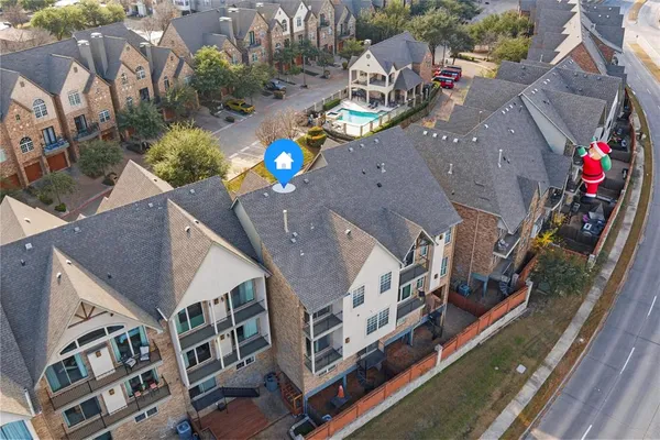 a view of a house with backyard and balcony