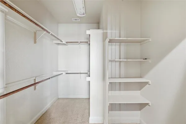 a view of an empty walk in closet