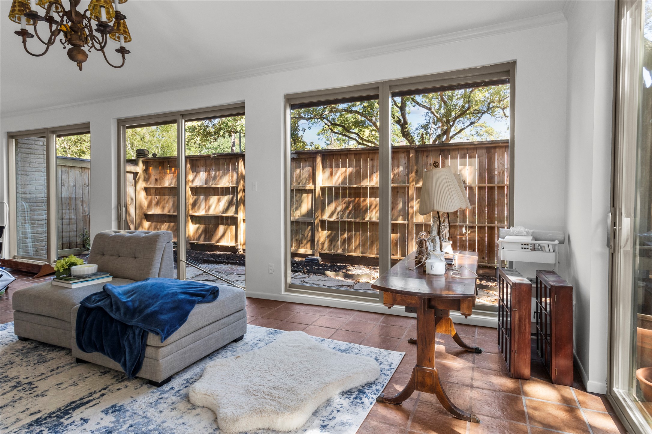 201 Vanderpool Lane, Unit 103 Houston, TX 77024 - Photo 17 of 28 a living room with furniture and a large window