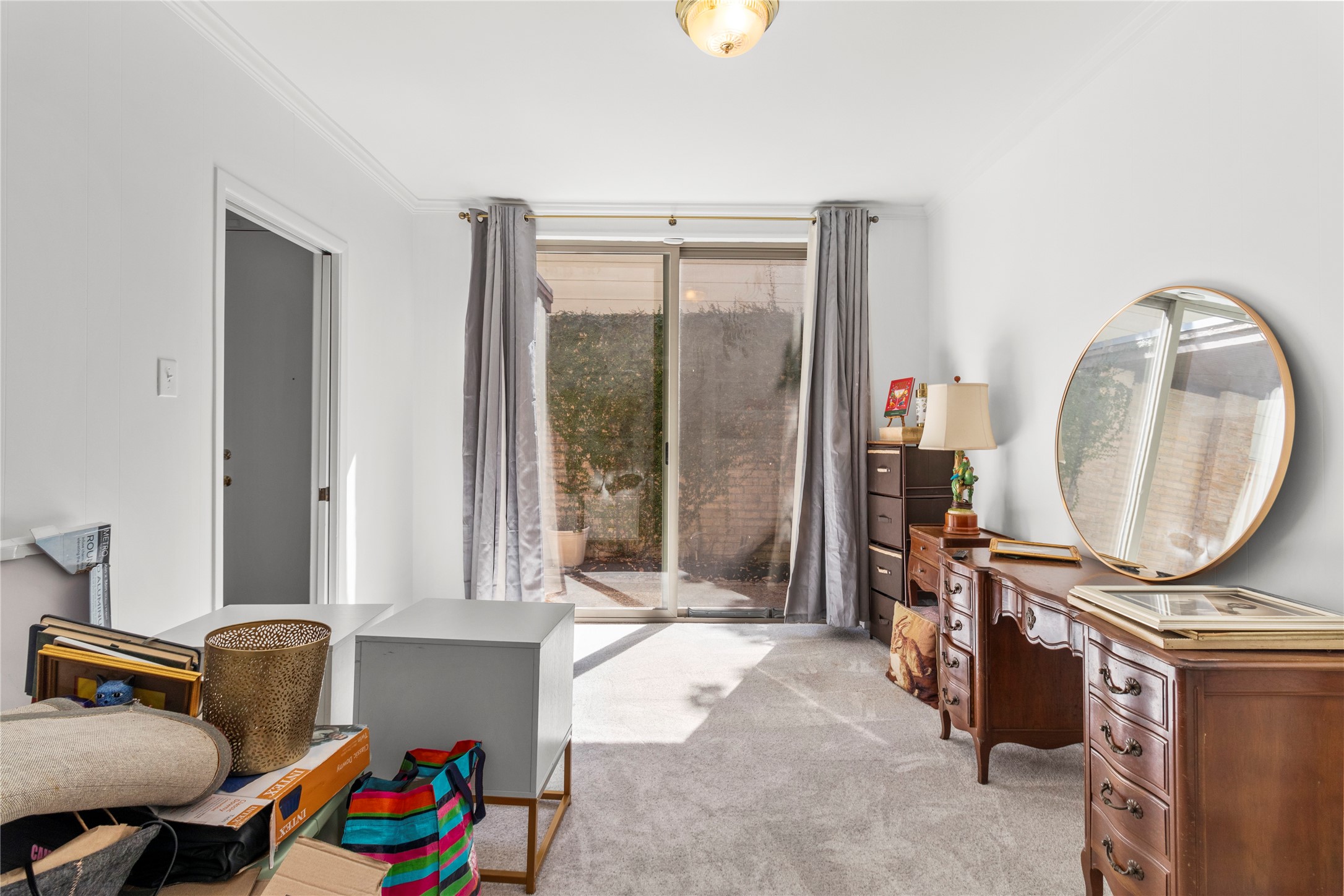 201 Vanderpool Lane, Unit 103 Houston, TX 77024 - Photo 20 of 28 a bedroom with furniture and a mirror