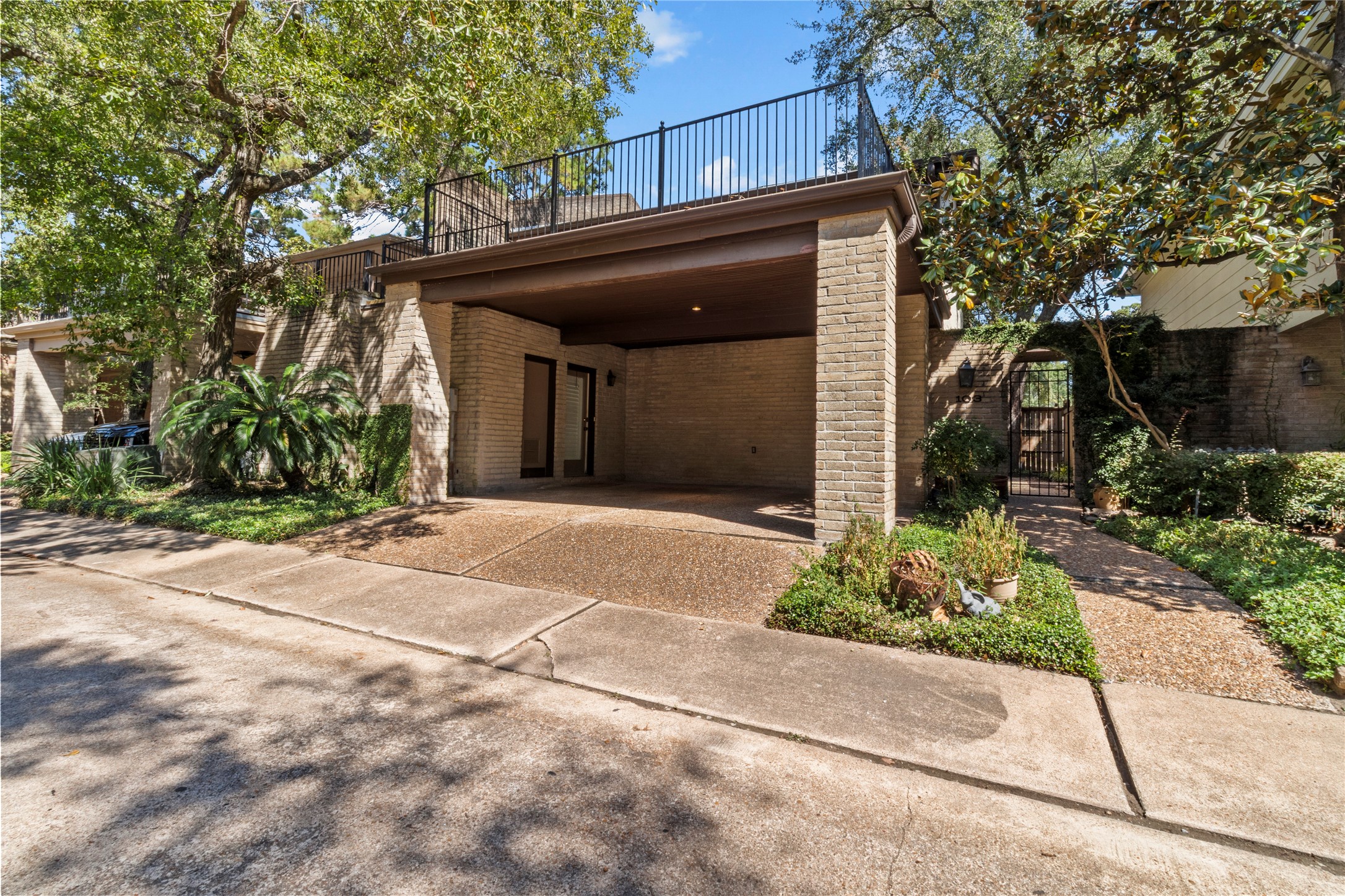 201 Vanderpool Lane, Unit 103 Houston, TX 77024 - Photo 2 of 28 a view of a house with a yard