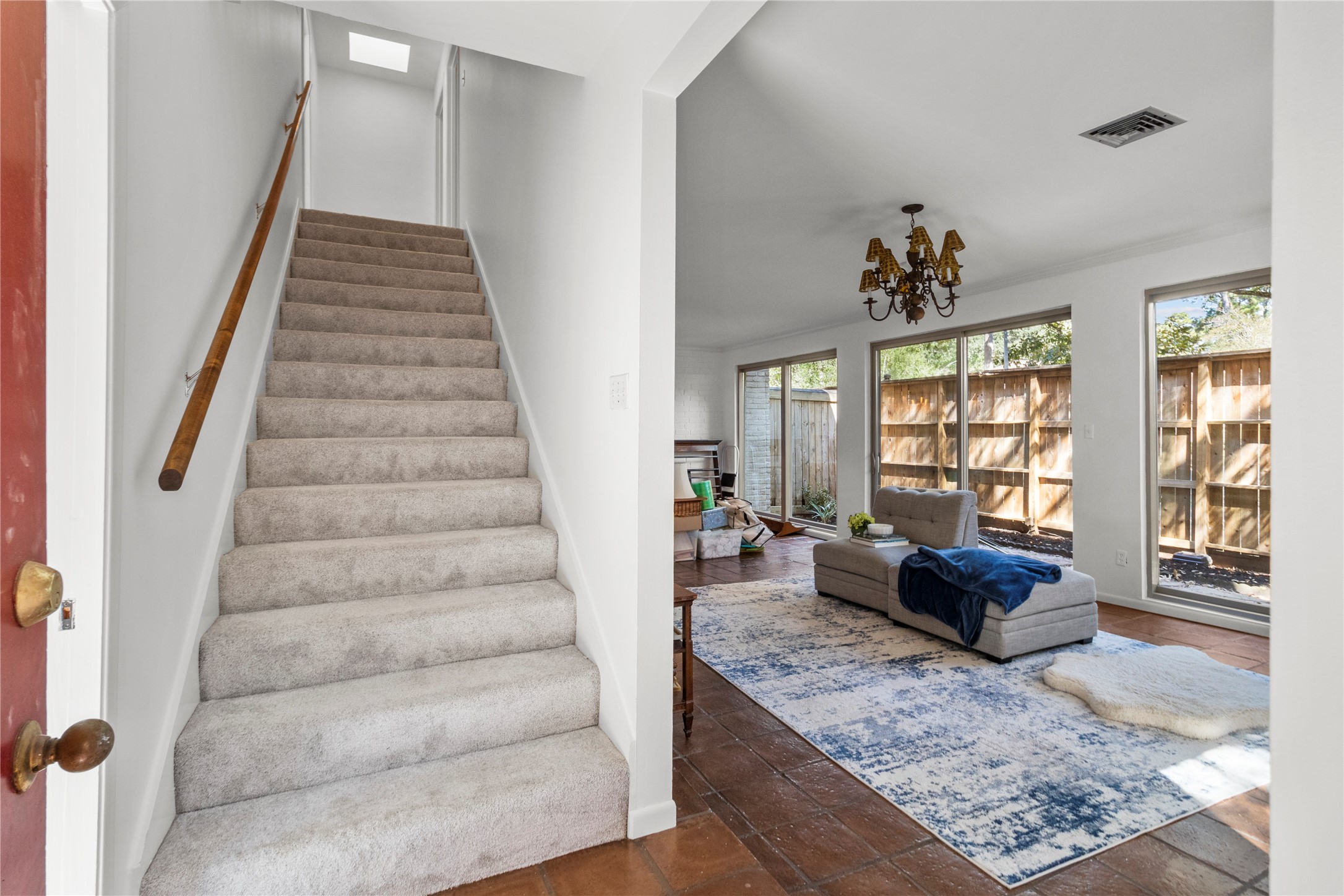 201 Vanderpool Lane, Unit 103 Houston, TX 77024 - Photo 21 of 28 a living room with furniture and a large window