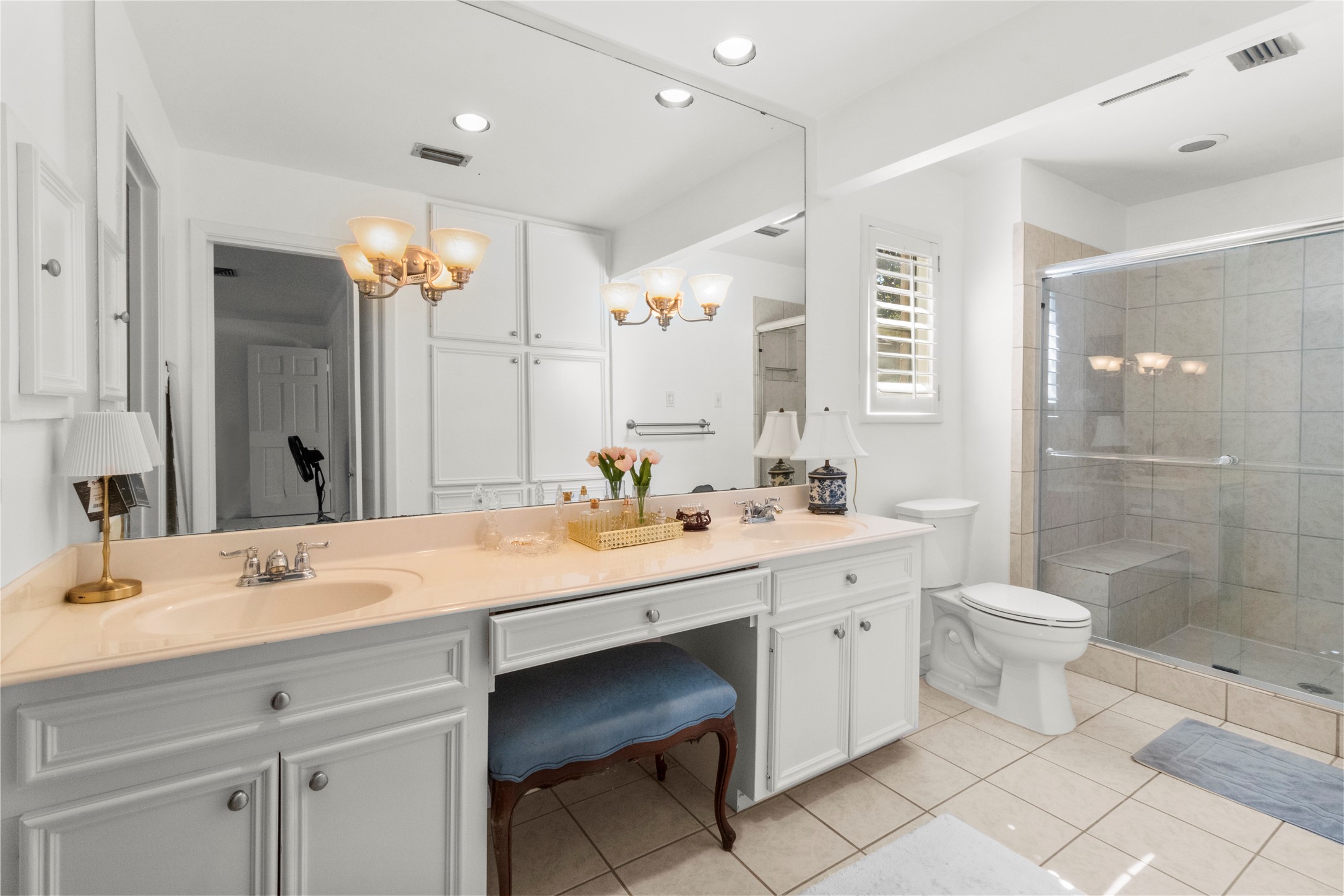 201 Vanderpool Lane, Unit 103 Houston, TX 77024 - Photo 25 of 28 a bathroom with a double vanity sink toilet and shower