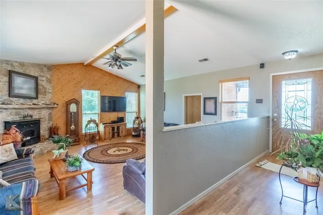 a view of a livingroom with furniture window and wooden floor