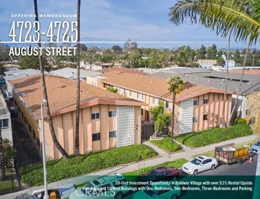 a view of a house with a yard and potted plants