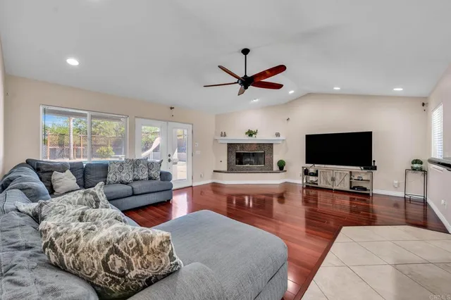 a bedroom with a bed and a ceiling fan