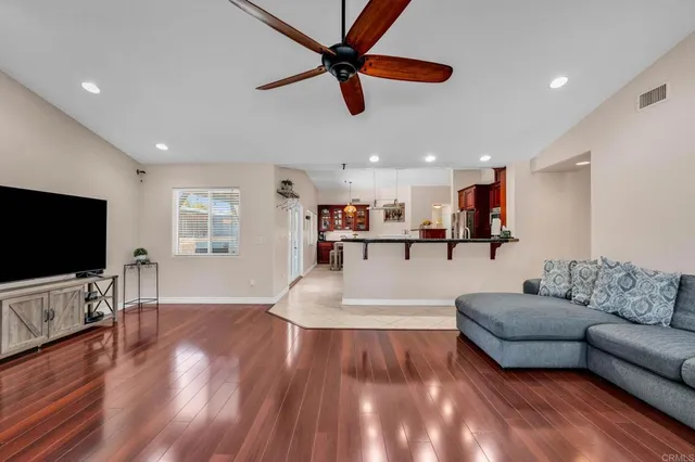 a bedroom with a bed window and a flat screen tv