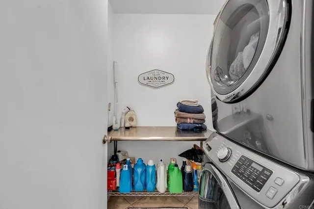 a bedroom with a bed and a flat screen tv with wooden floor