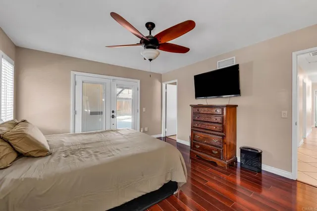 a spacious bathroom with a shower sink and mirror