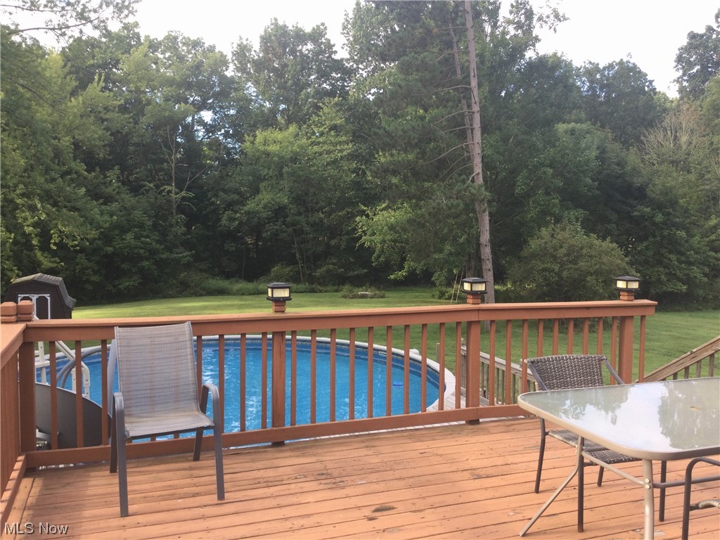 294 Lester Road New Franklin, OH 44319 - Photo 10 of 24 Wooden terrace with a huge lawn and pool