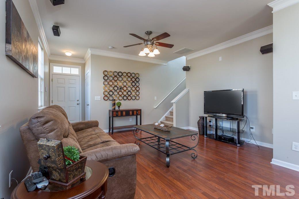 3709 Marshlane Way Raleigh, NC 27610 - Photo 3 of 9 a living room with furniture and a wooden floor