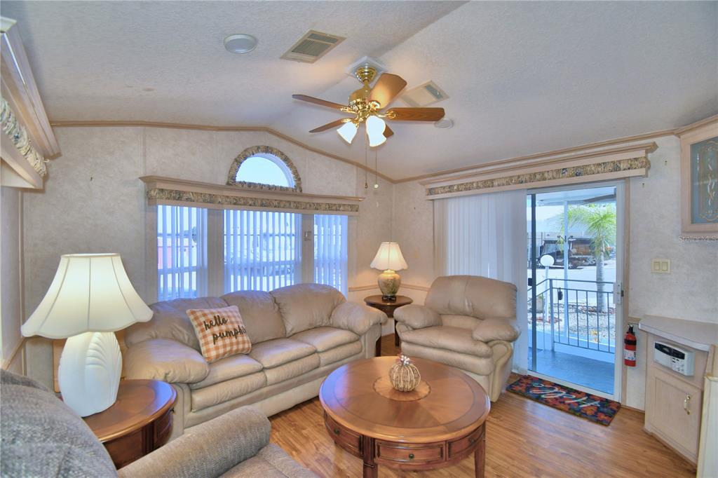 251 Patterson Road, Unit H17 Haines City, FL 33844 - Photo 11 of 47 a living room with furniture and a window