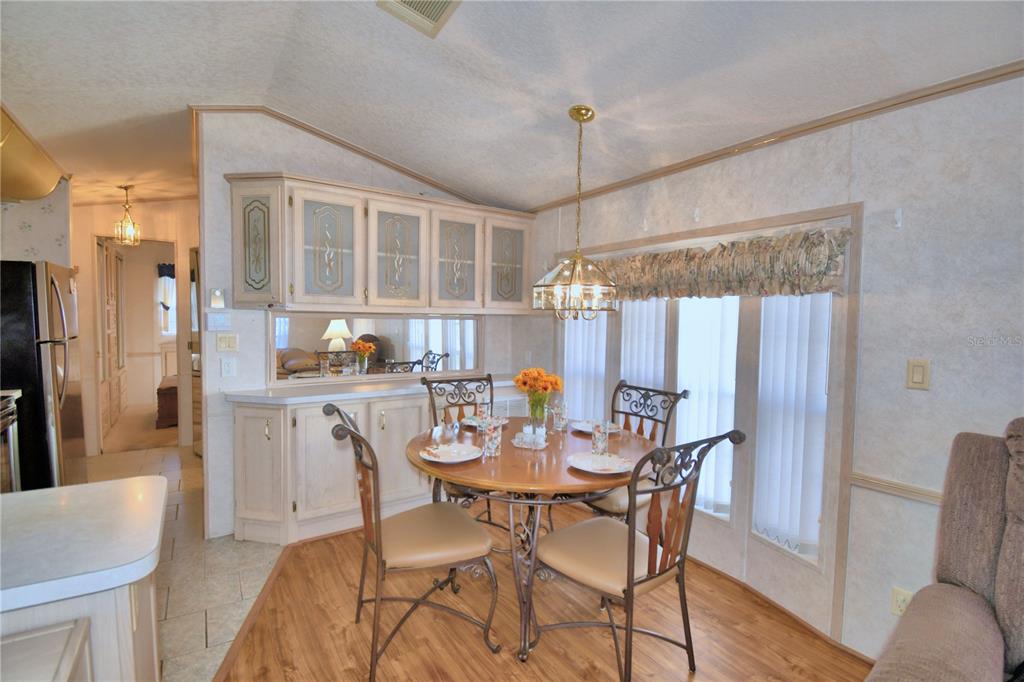 251 Patterson Road, Unit H17 Haines City, FL 33844 - Photo 13 of 47 a dining room with furniture and window
