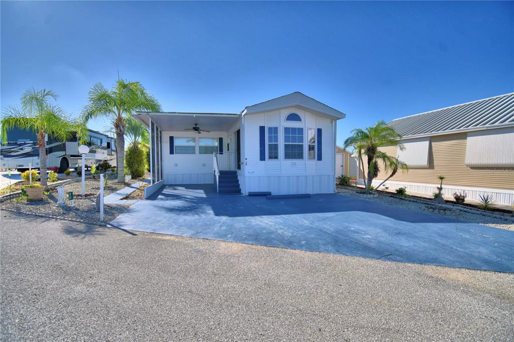 251 Patterson Road, Unit H17 Haines City, FL 33844 - Photo 2 of 47 a front view of a house with a yard