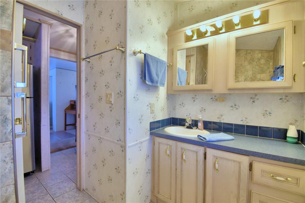 251 Patterson Road, Unit H17 Haines City, FL 33844 - Photo 22 of 47 a bathroom with a sink and a mirror