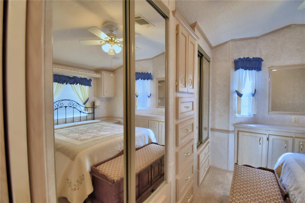 251 Patterson Road, Unit H17 Haines City, FL 33844 - Photo 26 of 47 a en suite bathroom with a granite countertop sink and a mirror