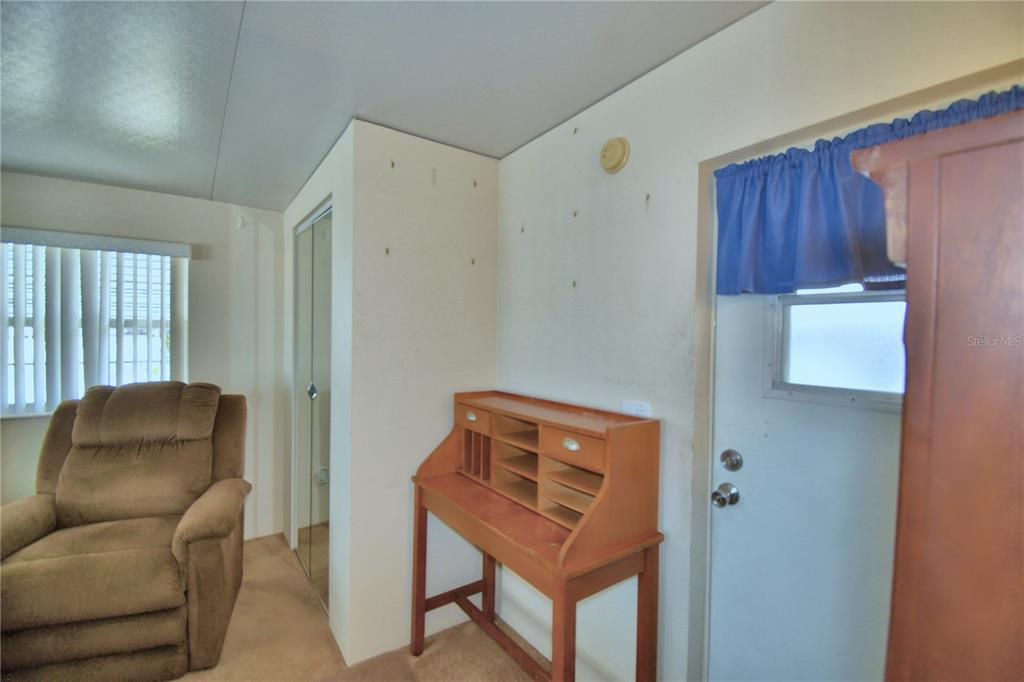 251 Patterson Road, Unit H17 Haines City, FL 33844 - Photo 27 of 47 a room with furniture and a window