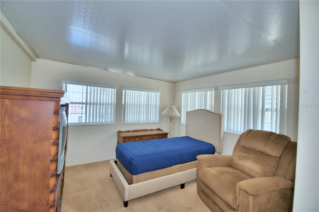 251 Patterson Road, Unit H17 Haines City, FL 33844 - Photo 28 of 47 a living room with furniture and a window