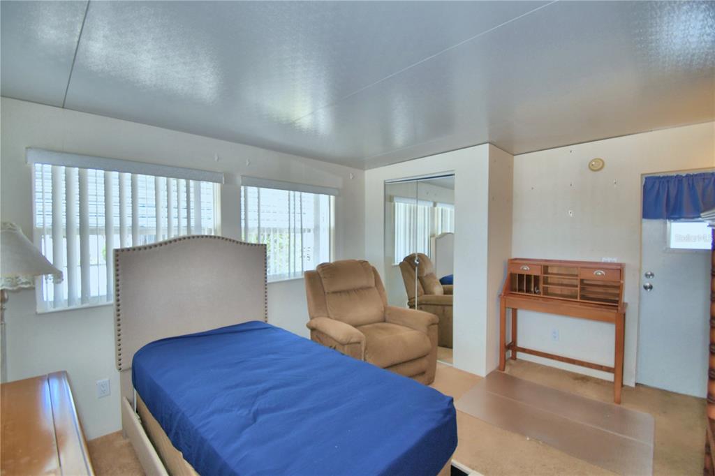 251 Patterson Road, Unit H17 Haines City, FL 33844 - Photo 29 of 47 a living room with furniture and a large window