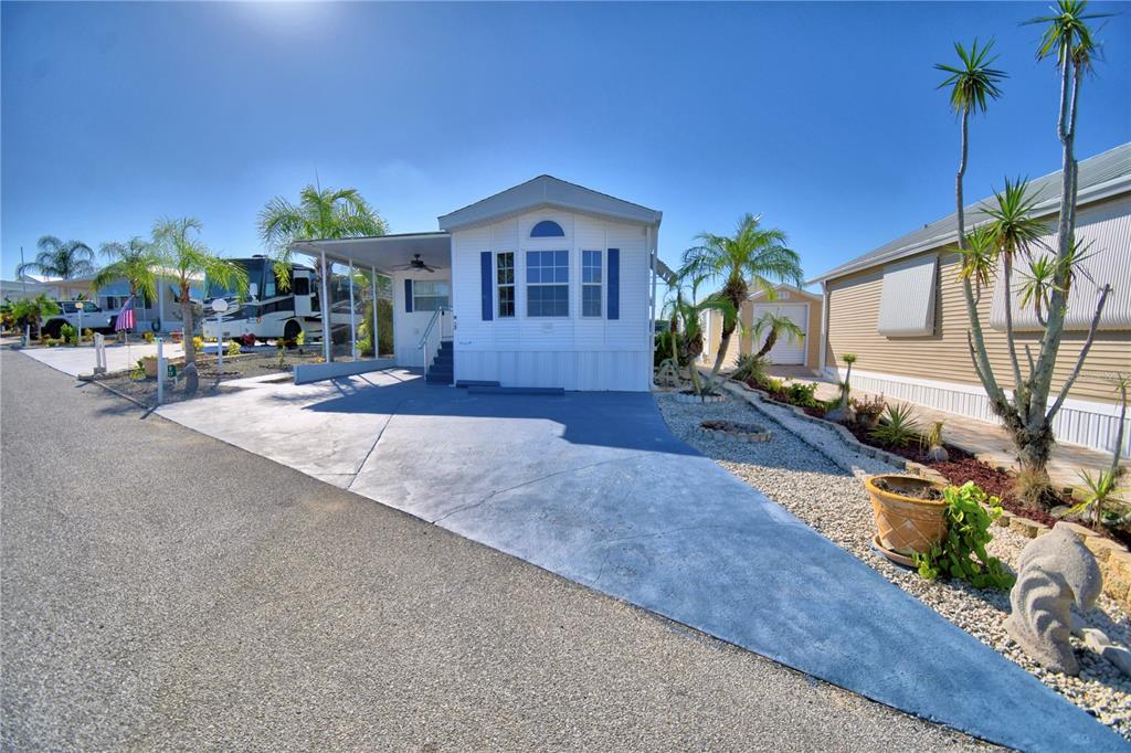 251 Patterson Road, Unit H17 Haines City, FL 33844 - Photo 3 of 47 a front view of a house with a yard