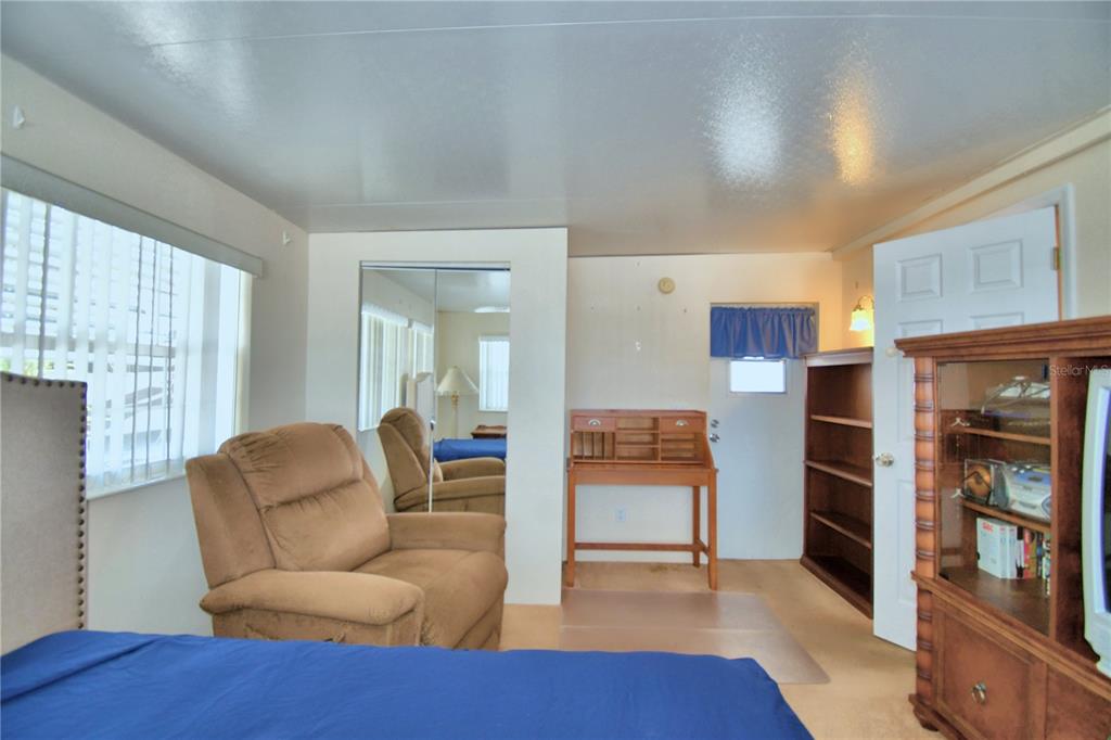 251 Patterson Road, Unit H17 Haines City, FL 33844 - Photo 31 of 47 a living room with furniture and a wooden floor