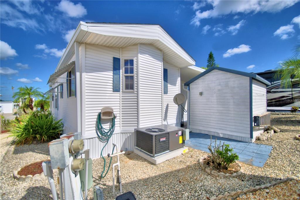 251 Patterson Road, Unit H17 Haines City, FL 33844 - Photo 34 of 47 a view of a chairs and table in backyard