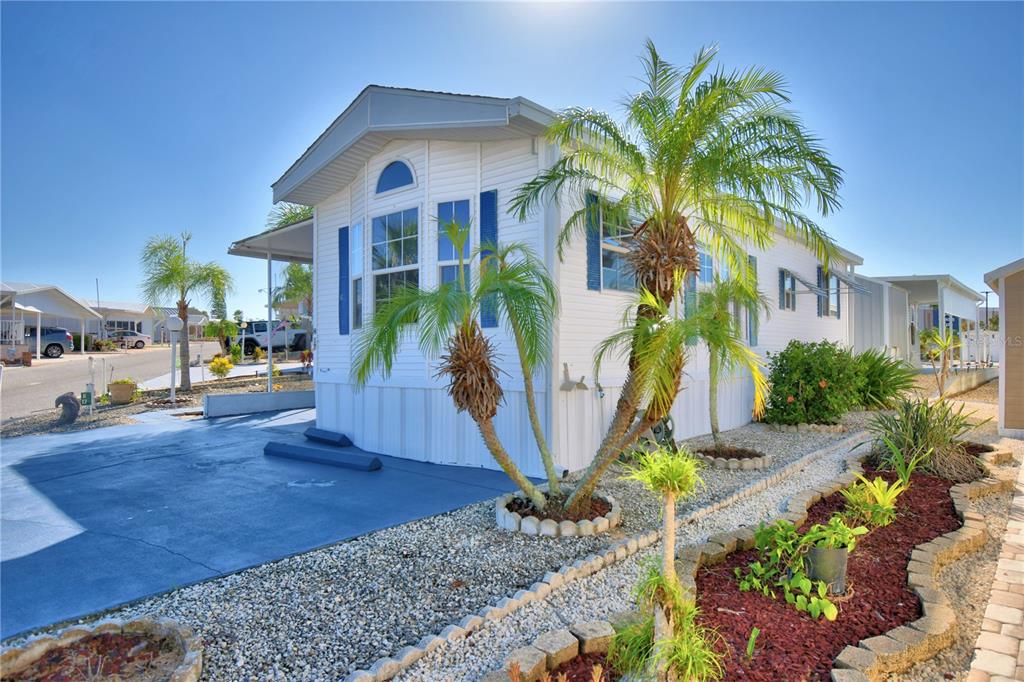 251 Patterson Road, Unit H17 Haines City, FL 33844 - Photo 4 of 47 a front view of a house with garden