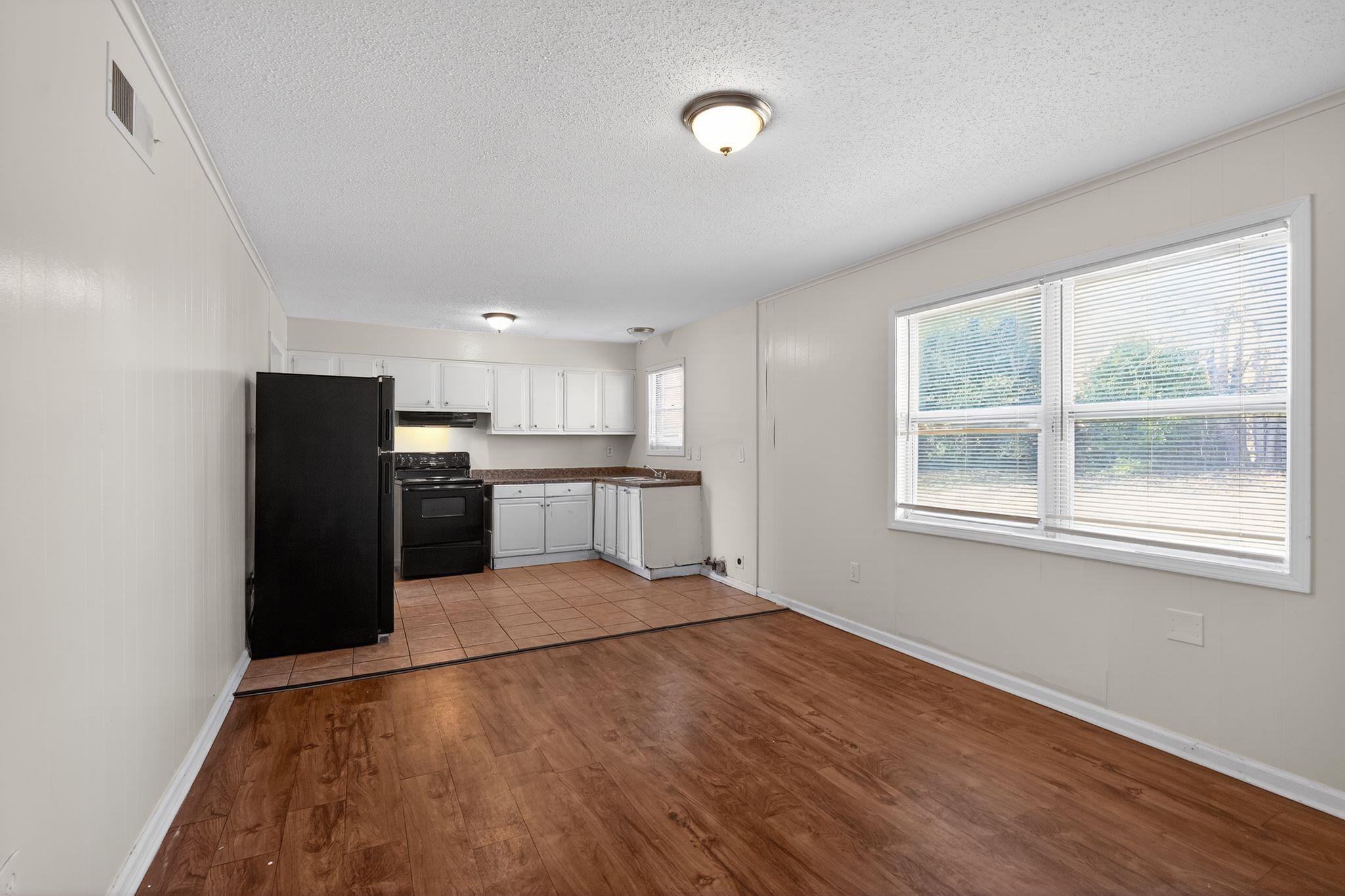 3637 Neely Road Memphis, TN 38109 - Photo 12 of 30 a view of kitchen with refrigerator and window