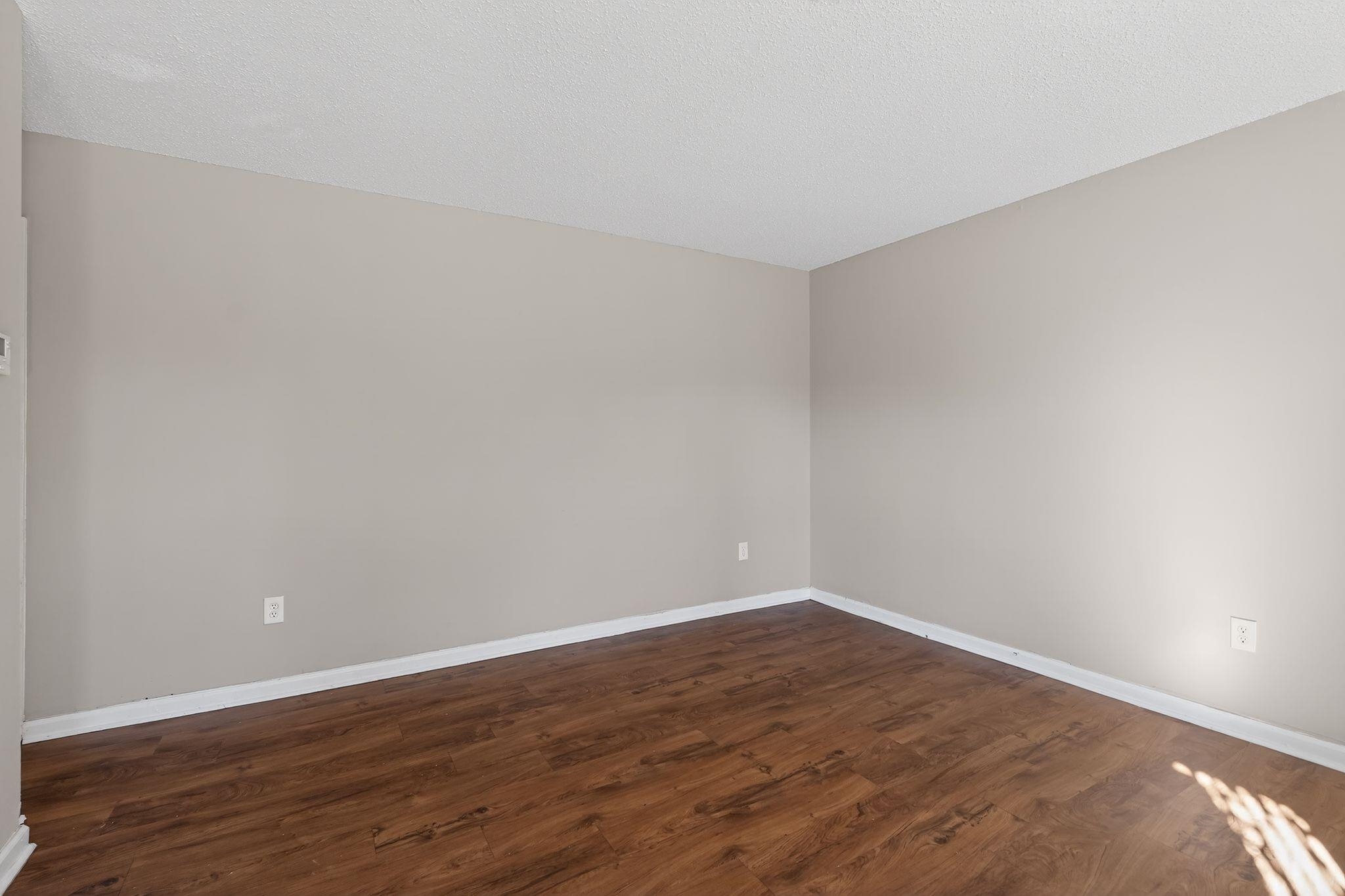 3637 Neely Road Memphis, TN 38109 - Photo 13 of 30 a view of an empty room with wooden floor