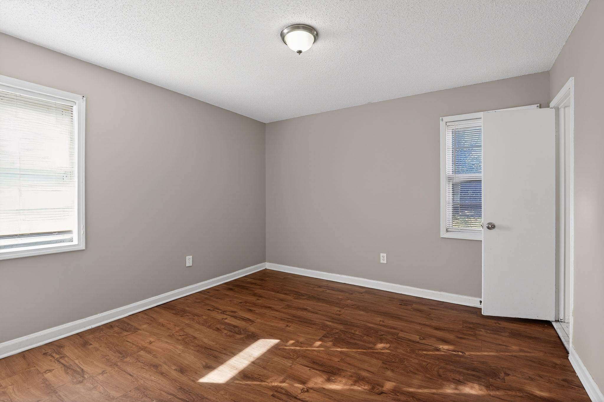 3637 Neely Road Memphis, TN 38109 - Photo 17 of 30 a view of empty room with wooden floor