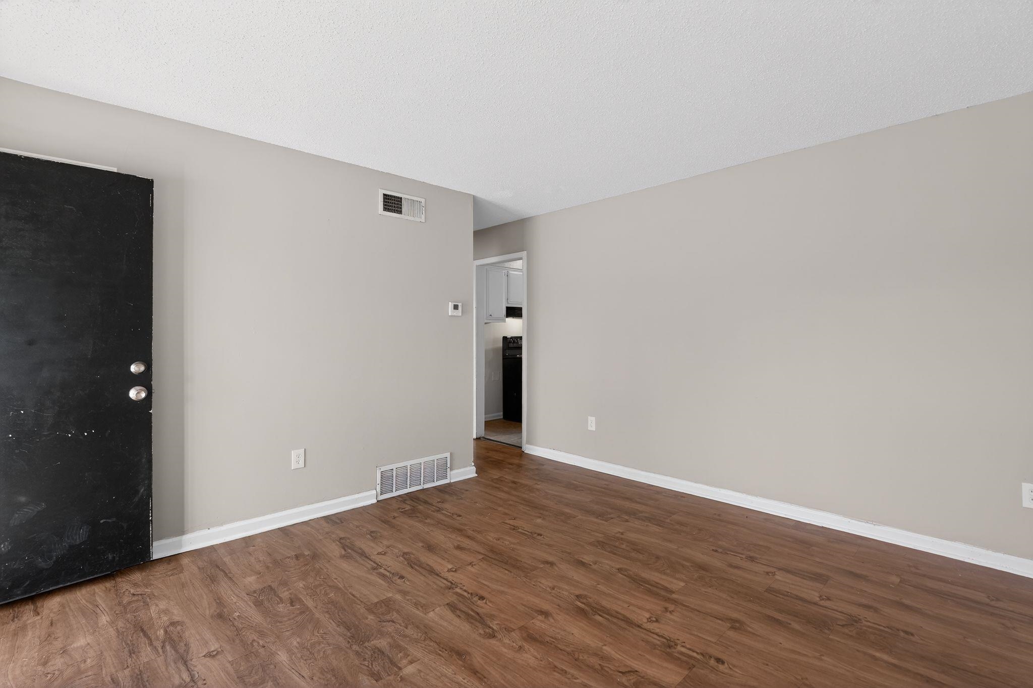 3637 Neely Road Memphis, TN 38109 - Photo 8 of 30 a view of an empty room with wooden floor