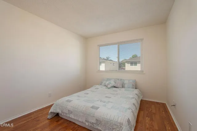 a bedroom with a bed and a shower