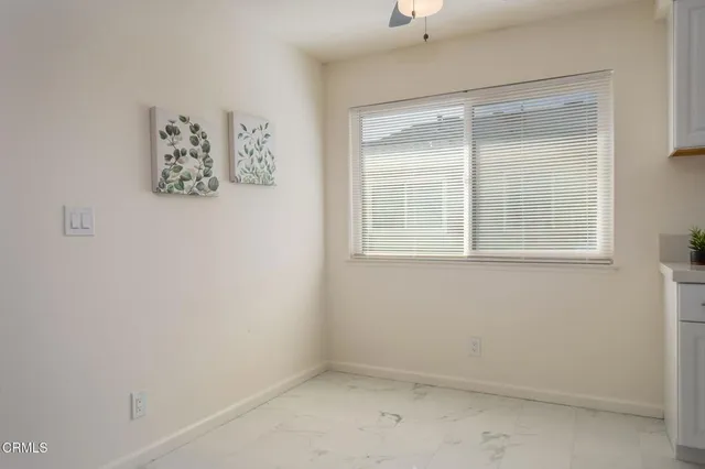 a kitchen with a sink a stove and cabinets