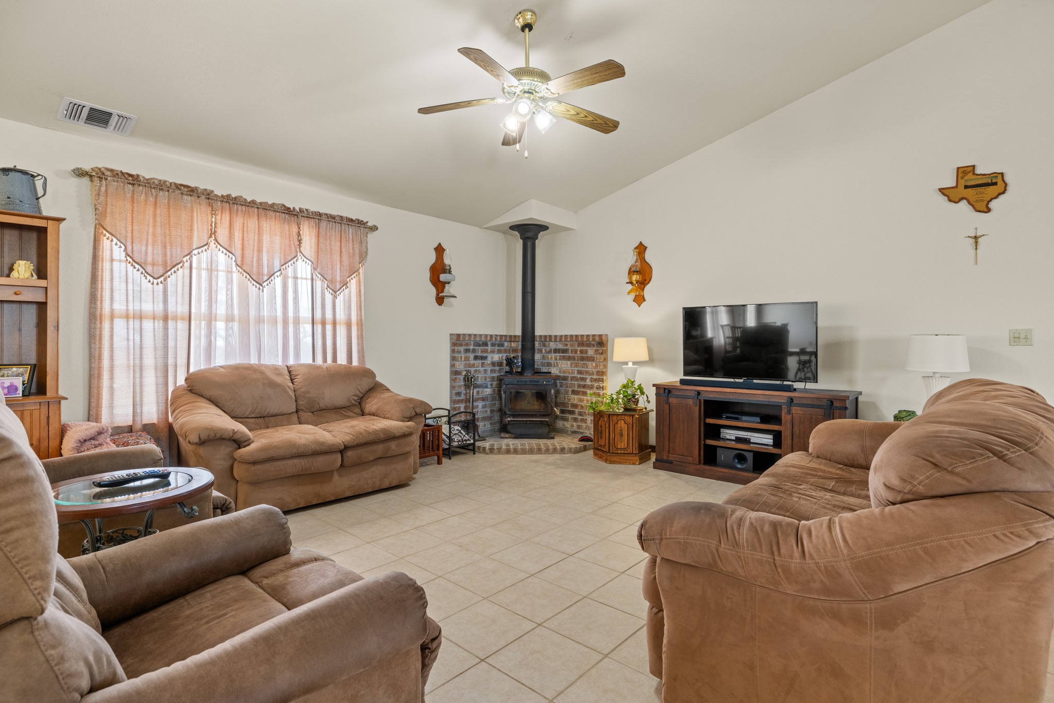 2020 Wendel Road Harper, TX 78631 - Photo 12 of 40 a living room with furniture and a flat screen tv