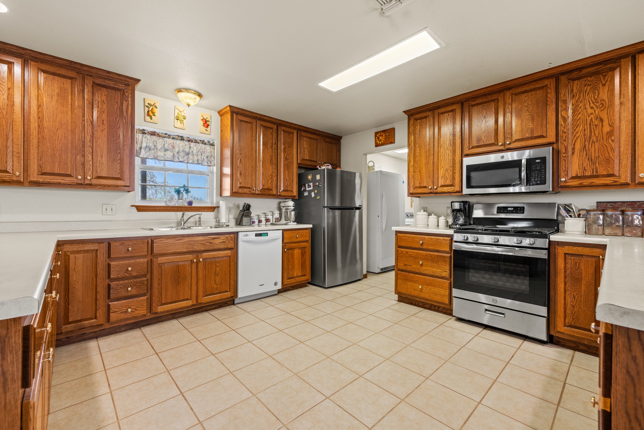 2020 Wendel Road Harper, TX 78631 - Photo 13 of 40 a kitchen with stainless steel appliances a stove sink microwave and cabinets