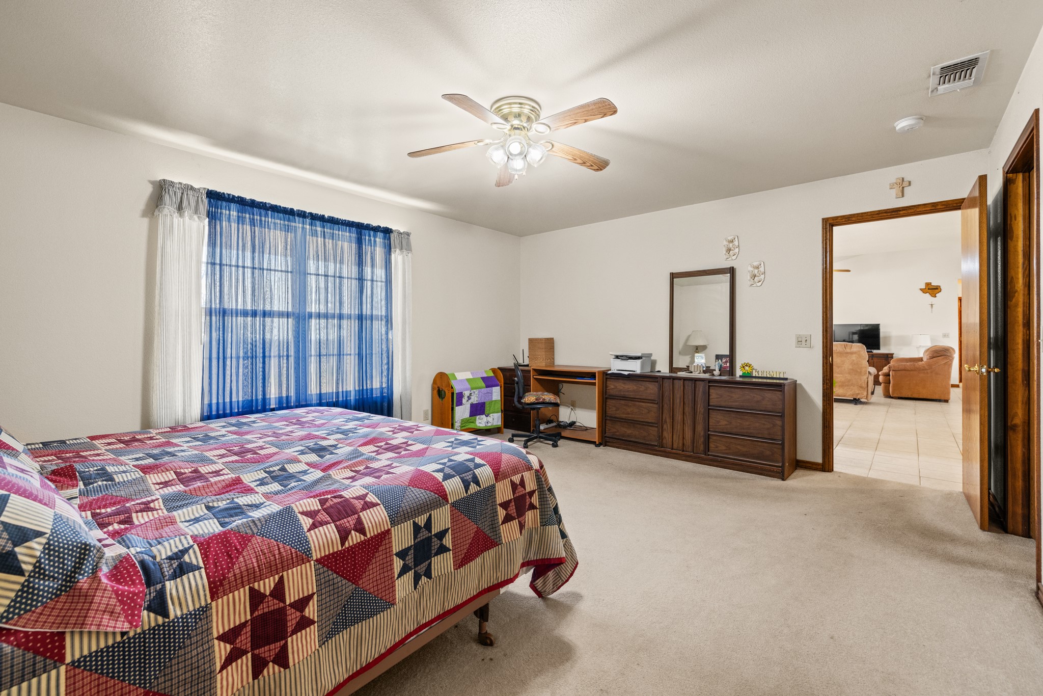 2020 Wendel Road Harper, TX 78631 - Photo 17 of 40 a bedroom with a bed and a chandelier