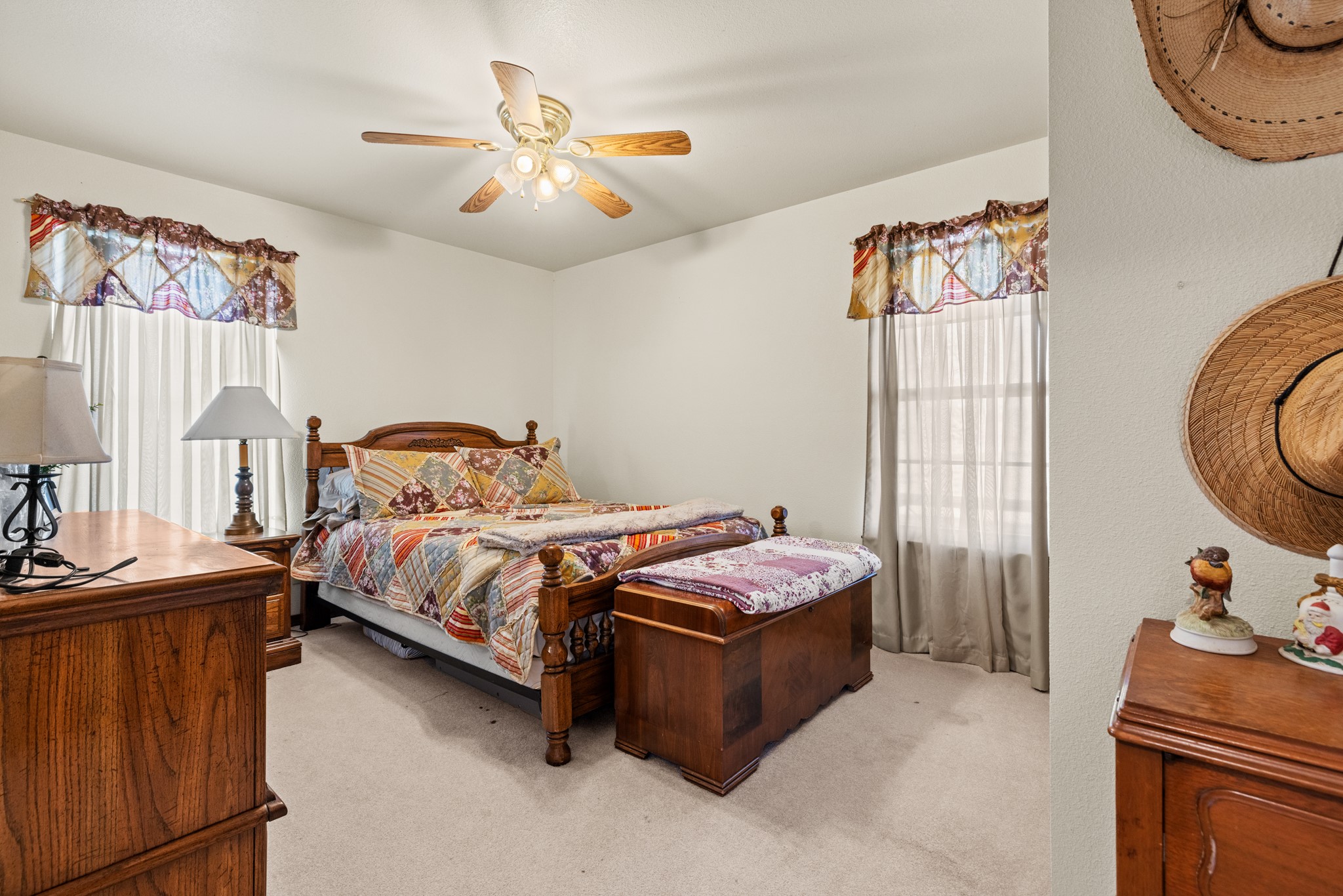2020 Wendel Road Harper, TX 78631 - Photo 21 of 40 a bedroom with a bed and a chandelier