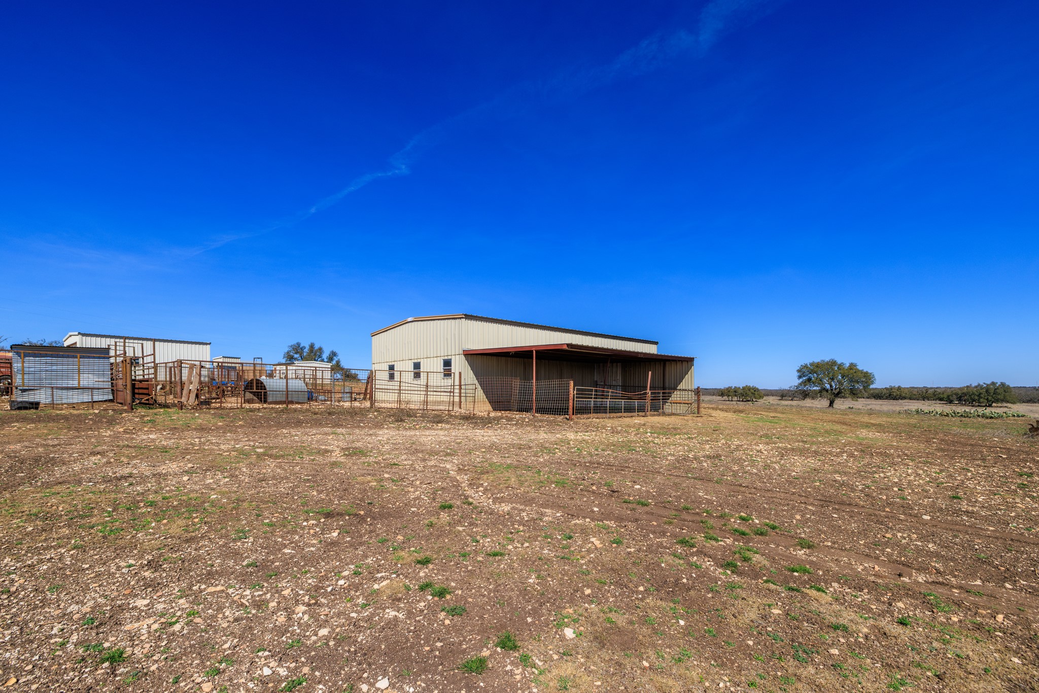 2020 Wendel Road Harper, TX 78631 - Photo 27 of 40 a view of a dry yard with a house