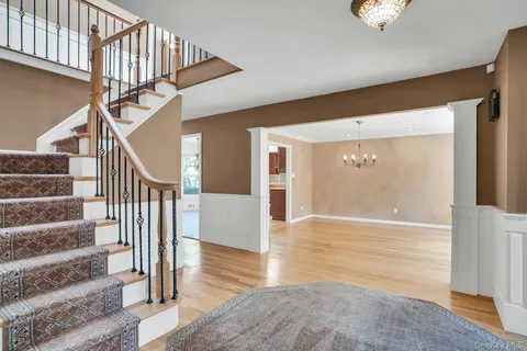 a view of an entryway with wooden floor