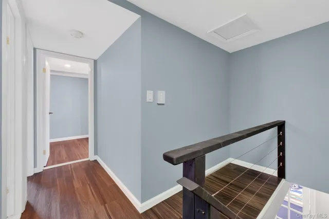 a view of entryway with wooden floor