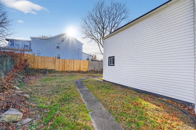 a view of a backyard with pathway