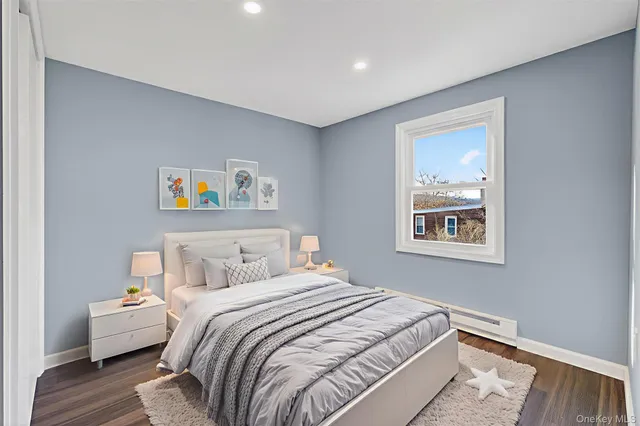 a bedroom with bed and a window